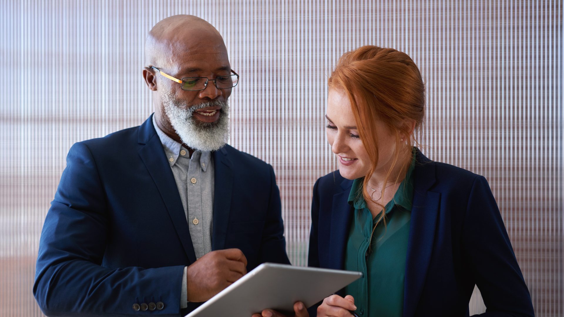 A one-to-one mentoring conversation in a neutral office space