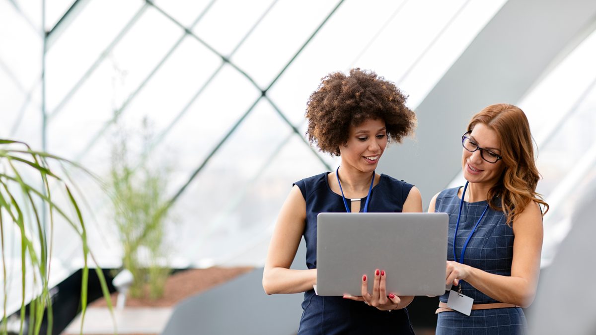 Two women collaborating in a bright office